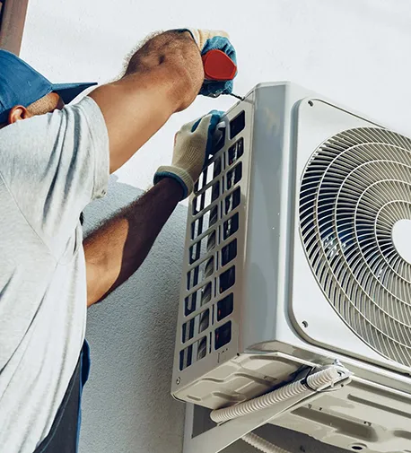 Technician servicing an AC unit, highlighting the benefits of choosing AC Installation Services in Silver Springs Shores, FL.
