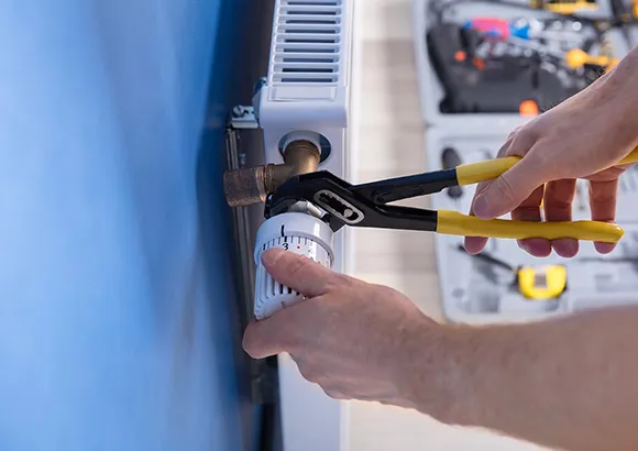 Technician working on a heating system, providing affordable assistance in Silver Springs Shores.