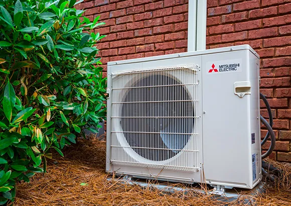 Professional technician working on a ductless AC unit in Gainesville, FL, providing expert repair and maintenance services.