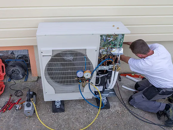 Technician repairing a reliable central air unit in Belleview, FL.