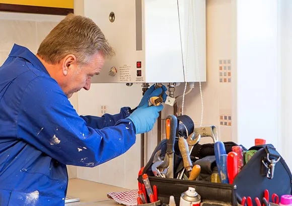 Technician repairing a heating panel, ensuring reliable service in Ocala, FL.
