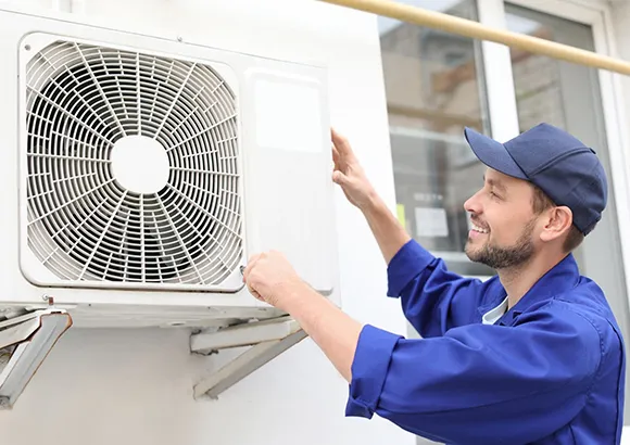 Technician installing a high-quality air conditioning unit for optimal cooling in Dunnellon, FL.