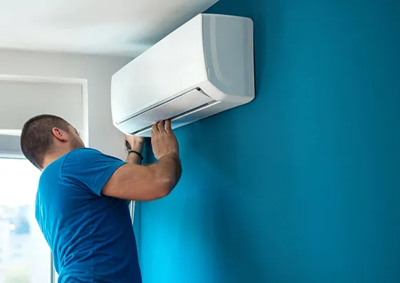 Professional installing a central air conditioning system in Belleview, FL, ensuring reliable climate control.