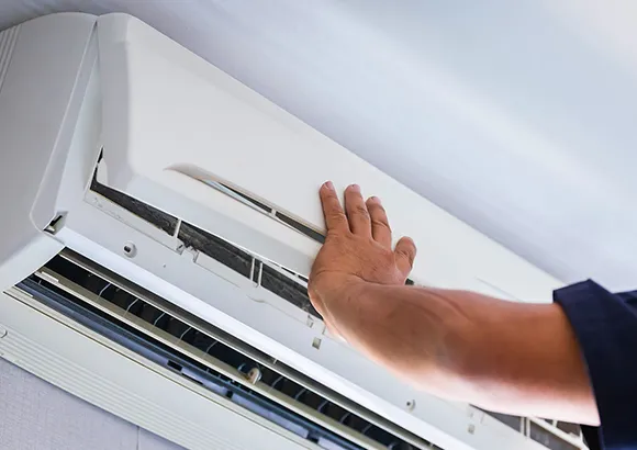 Technician repairing a trusted split system AC in Ocala, Florida, ensuring reliable service.